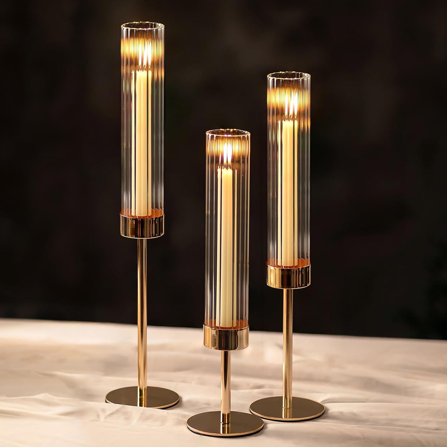 NUPTIO Tall Candlestick Holders - Elegant Hurricane Candle Holders with Ribbed Glass Sleeve | Gold Metal Set of 3 for Table & Fireplace Decor
