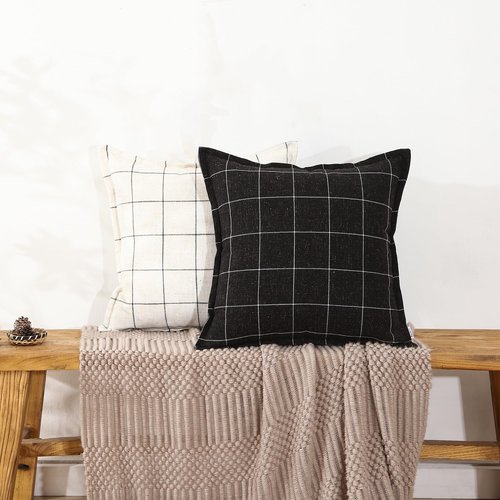 A Striped Pillow in White and Black, with a Bohemian Style. The Back Features a Hidden Zipper Design That resembles an Envelope. Made of Linen. Each Pack Contains Two 20×20-inch Hand-Stitched Edges.