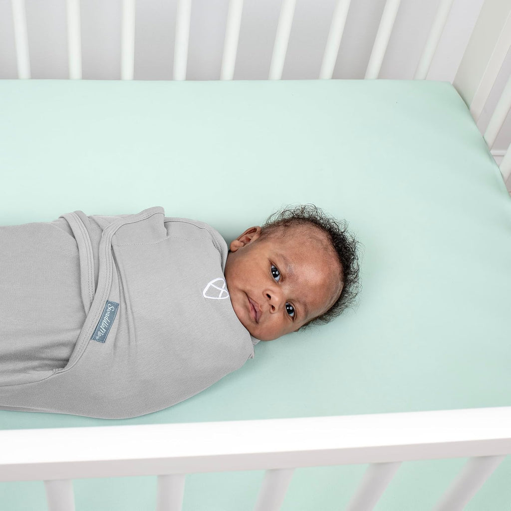 SwaddleMe by Ingenuity Baby Swaddle Blanket - 100% Cotton, 0-3 Months, Improves Sleep & Calms Reflex | Tropical Dino, 2-Pack