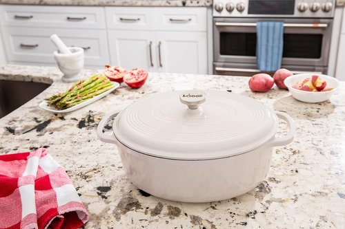 Lodge Enameled Cast Iron Dutch Oven - 7 Quart Oval with Lid & Dual Handles - Oven Safe to 500°F - Oyster White