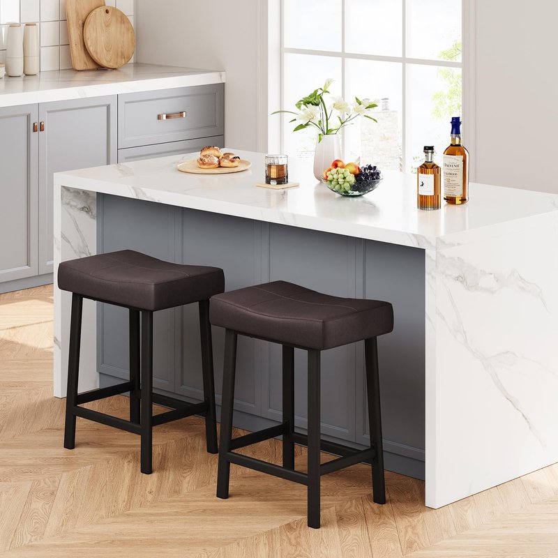 IDEALHOUSE 24 Inch Backless Saddle Barstools Set of 2, Counter Height Upholstered Padded Barstools with Curved Surface, Metal Leg and Footrest, for Kitchen Counter, Home Bar (Brown, 24 inch-Set of 2)