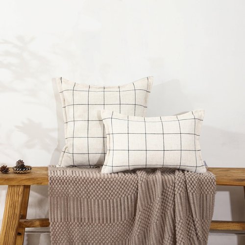 A Striped Pillow in White and Black, with a Bohemian Style. The Back Features a Hidden Zipper Design That resembles an Envelope. Made of Linen. Each Pack Contains Two 20×20-inch Hand-Stitched Edges.