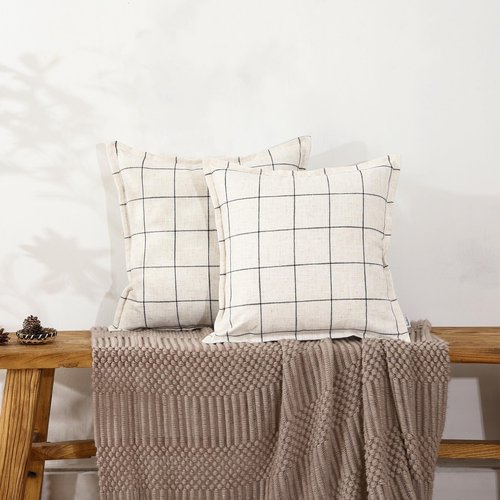 A Striped Pillow in White and Black, with a Bohemian Style. The Back Features a Hidden Zipper Design That resembles an Envelope. Made of Linen. Each Pack Contains Two 20×20-inch Hand-Stitched Edges.
