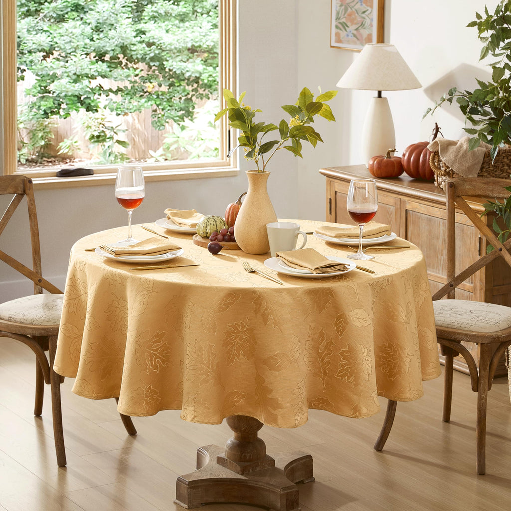 Newbridge Gold Fancy Leaves Damask Fabric Holiday Tablecloth, 70 Inch Round, Elegant Swirling Leaf Pattern, No Iron Soil Resistant Dining Room Party Table Cover